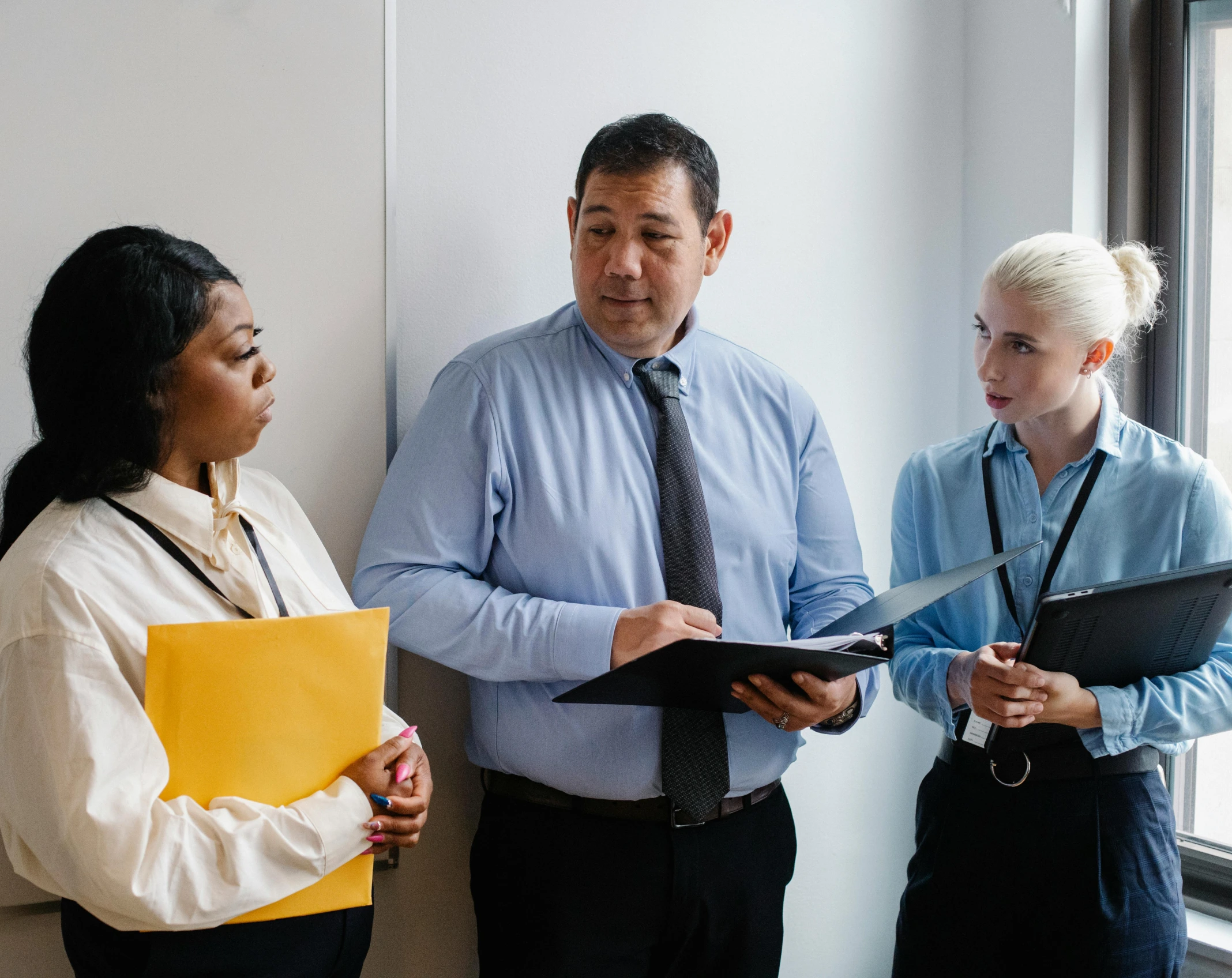 A man and 2 women discussion